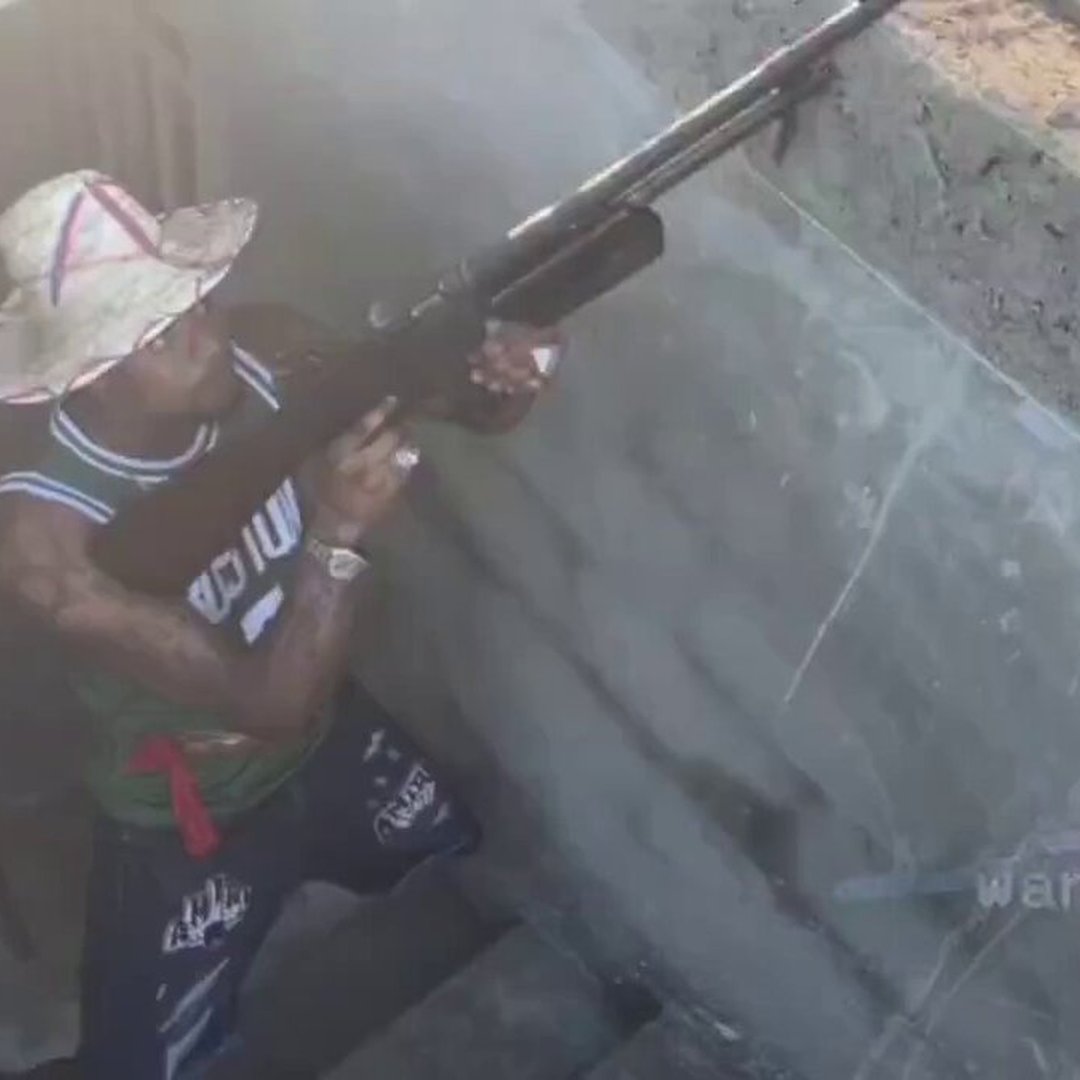 Haitian Gang Leader Filmed ‘Blessing’ Members And Weapons With Rum As They Reportedly ‘Prepare For War’