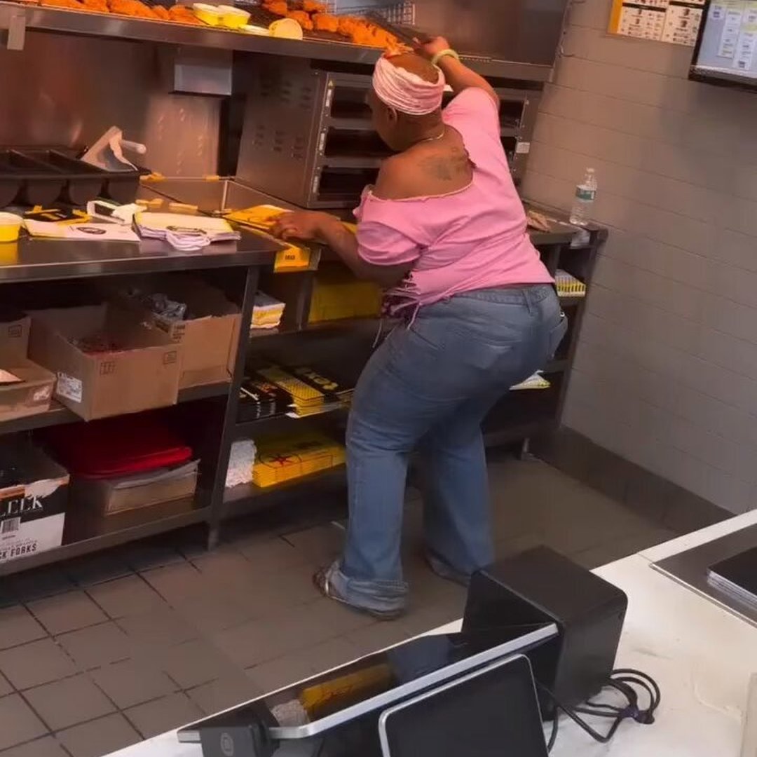 Woman Climbs Counter to Snatch Chicken