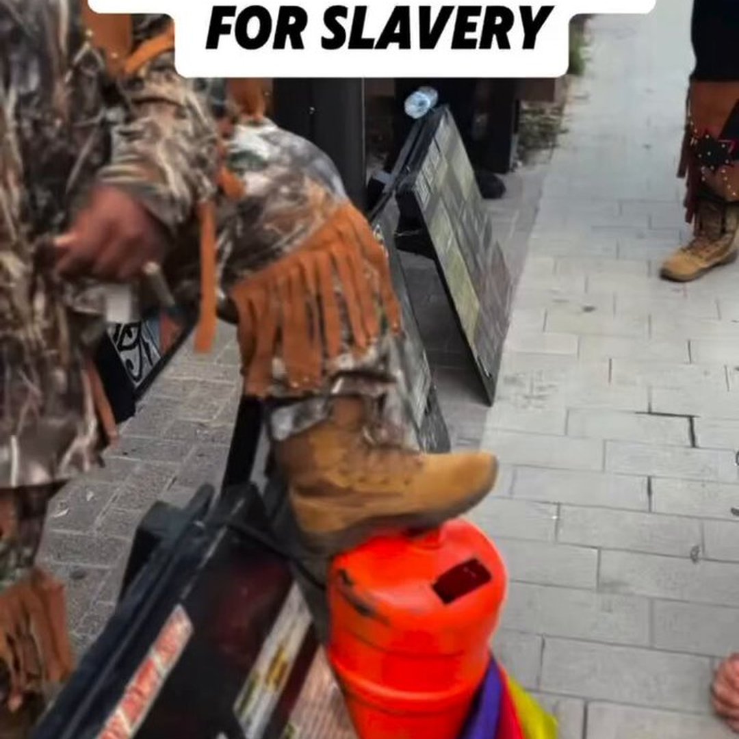 White Man Sparks Debate After Getting on His Knees to Kiss Black Men’s Feet in Apology for “White Privilege & Racism”