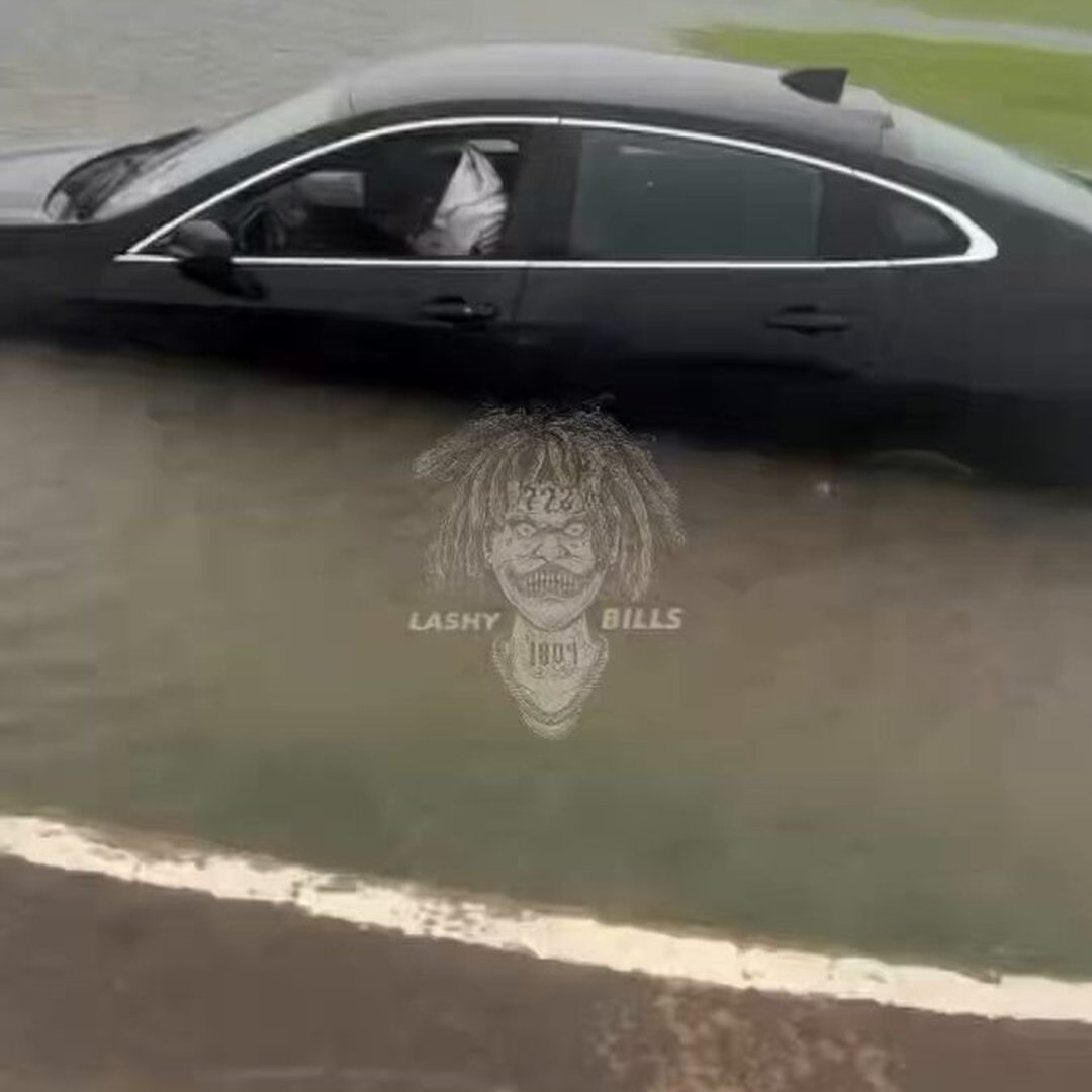 Man Struggles to Navigate Floodwaters from Tropical Storm Arthur