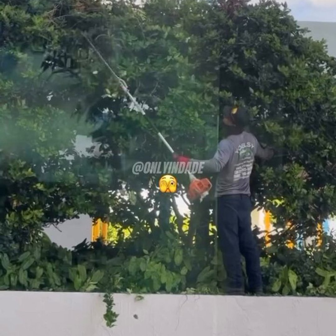 This landscaper is living on the edge… literally. 