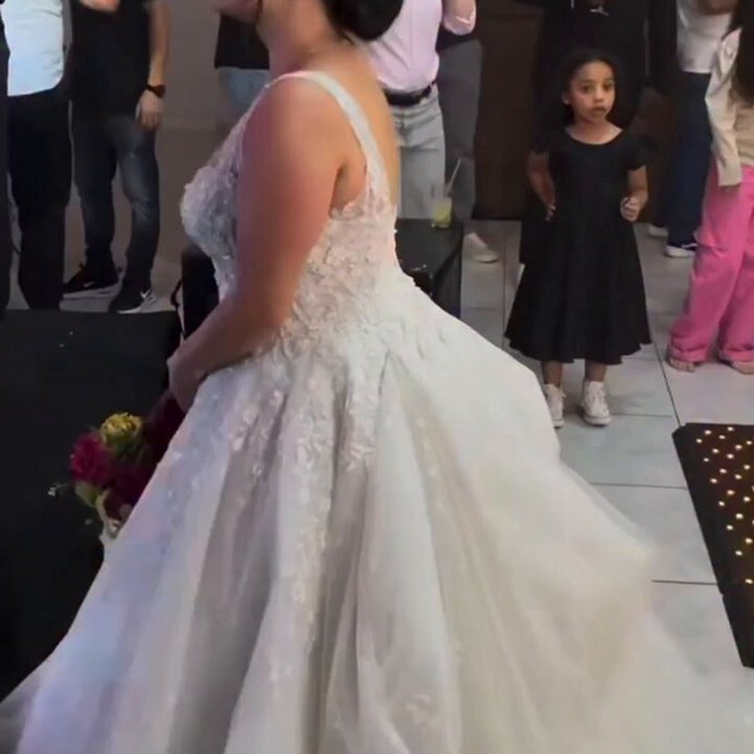 Woman Goes Viral After Walking Between a Man and His Kneeling Proposal to Grab the Bouquet