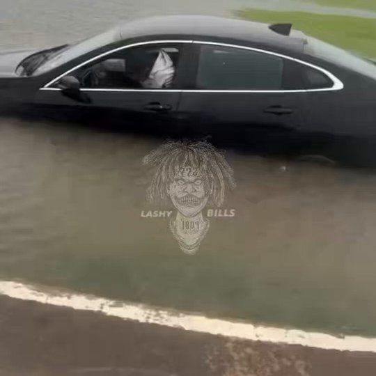 Man Struggles to Navigate Floodwaters from Tropical Storm Arthur
