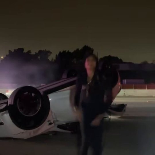 Woman Celebrates After Flipping Her Car on Highway