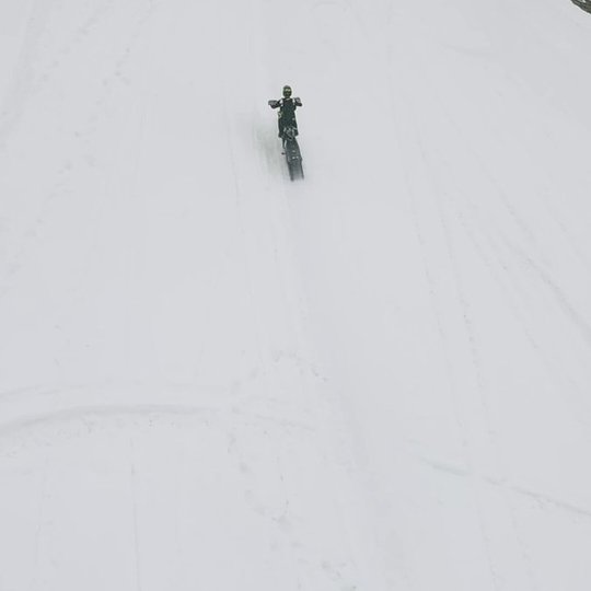 Cody Matechuk Breaks Record With 450-Foot Snowbike BASE Jump Off Mountainside