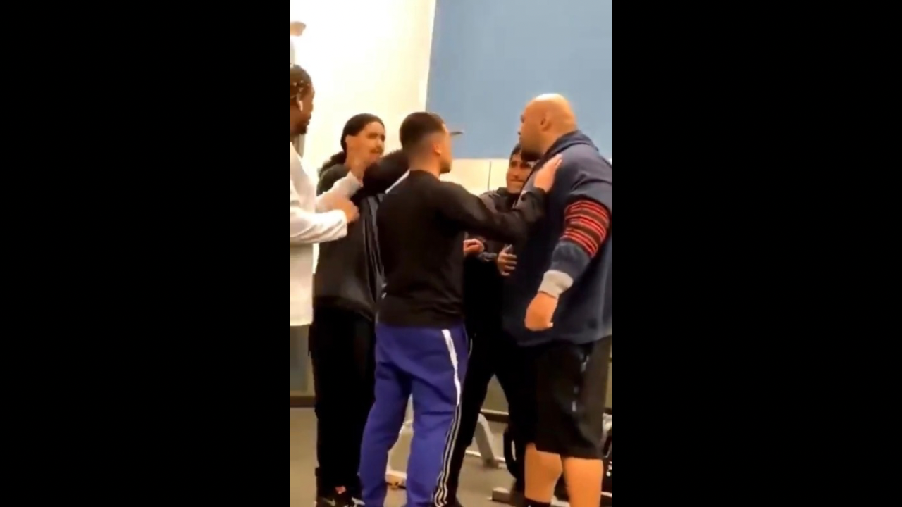 Man challenges bigger guy at gym but gets sat on helplessly